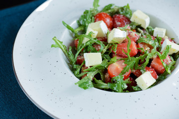 Greek salad with feta cheese, organic olives, juicy tomatoes, and lettuce. Concept for healthy nutrition.