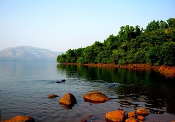 A beautiful tree reflection landscape of Mulshi Dam Pune