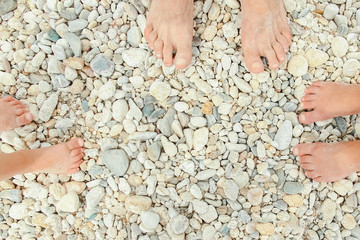 beautiful legs in the sand of the sea greece background