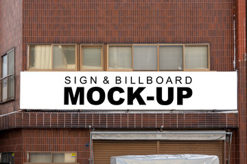 Mock up large outdoor billboard on brick wall of building