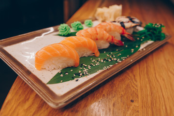 Large set of Sushi Rolls Warm Ebi Sake Unagi Spring. A lot assortment Philadelphia roll Dishes from Japanese raw fish  in one plate in traditional restaurant. Japan food menu service