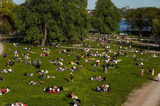 Stockholm, Sweden  People in the Ralambshovspark on a summer day during the Coronavirus pandemic.