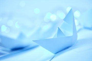 paper boats on the documents