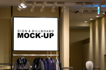Mock up horizontal signboard on showcase in cloths showroom
