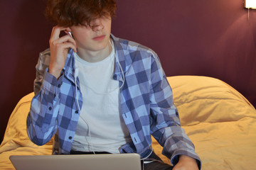 Young man with his laptop at home