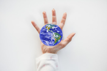 Women holding planet in hand against white background. World environment day concept. Elements of this image furnished by NASA