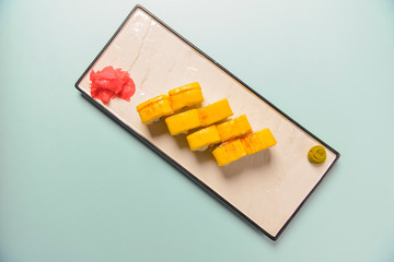 Sushi rolls philadelphia or california with cheddar and creame cheese, with tuna and avocado.