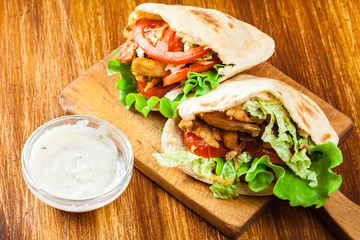 Doner kebab - fried chicken meat with vegetables