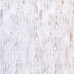 背景素材シリーズ---木の壁に白いペンキが塗ってあるが、経年劣化でひびが入り朽ち果てた素材