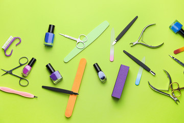 Supplies for manicure on color background