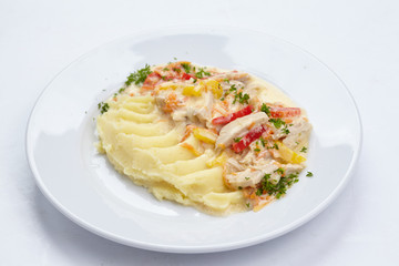 potato with meat on white plate