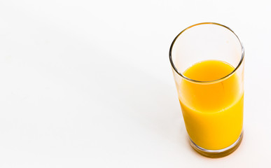 Glass of fresh orange juice isolated on white background. Vitamin C. Copy space.