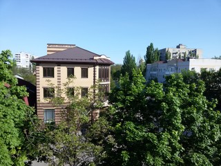 View from the balcony of a multi-storey building on the city houses