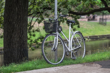 Fototapeta na wymiar Bicycle in the square at the water channel