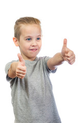 Young smiling caucasian boy shows thumbs up isolated on white background - 353064423