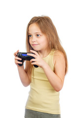 Young excited cute girl with grey blue eyes and long light brown hair plays computer game with joystick isolated on white background - 353064878