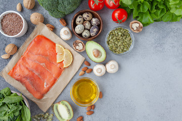 Healthy eating food low carb keto ketogenic diet meal.  Vegetables, fish, meat, nuts and quail eggs. Balanced diet food background.