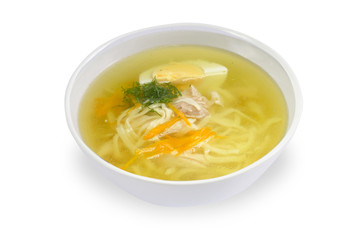 transparent noodle soup with boiled egg, parsley isolated on a white background