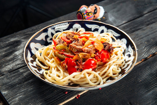 Uyghur laghman noodles in a traditional plate