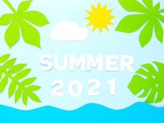 Fototapeta na wymiar A words SUMMER 2021 of paper cut letters on a blue summer background