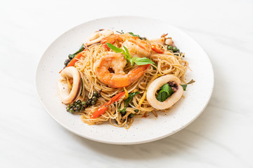 stir-fried Chinese noodle with basil, chilli, shrimps and squid