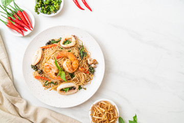 stir-fried Chinese noodle with basil, chilli, shrimps and squid