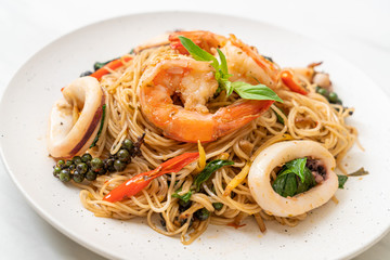 stir-fried Chinese noodle with basil, chilli, shrimps and squid