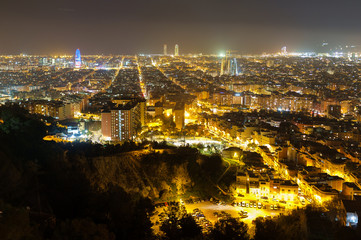 Obraz premium View from the top of Park Guinardo, one of the east side hills in Barcelona. The night skyline of Barcelona. 