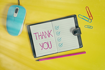 Writing note showing Thank You. Business concept for a polite expression used when acknowledging a...