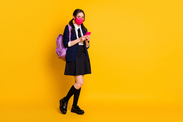 Full length body size view of her she nice attractive brown-haired girl going back to school using digital device 5g app blogging isolated on bright vivid shine vibrant yellow color background