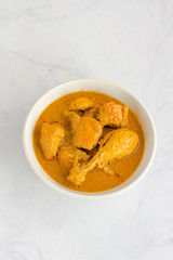 Vertical Top Down Flat Lay Photo of Indian Chicken Curry