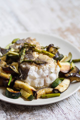 A portion of roasted conger eel with vegetables