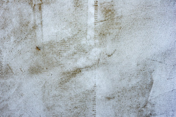 Texture of a concrete wall with cracks and scratches which can be used as a background