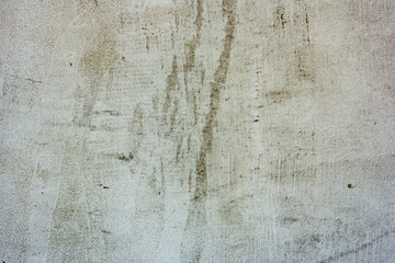Texture of a concrete wall with cracks and scratches which can be used as a background