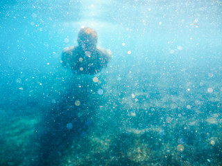 Being underwater. Clean aegean sea. Nature on the island Santorini, Cyclades, Greece