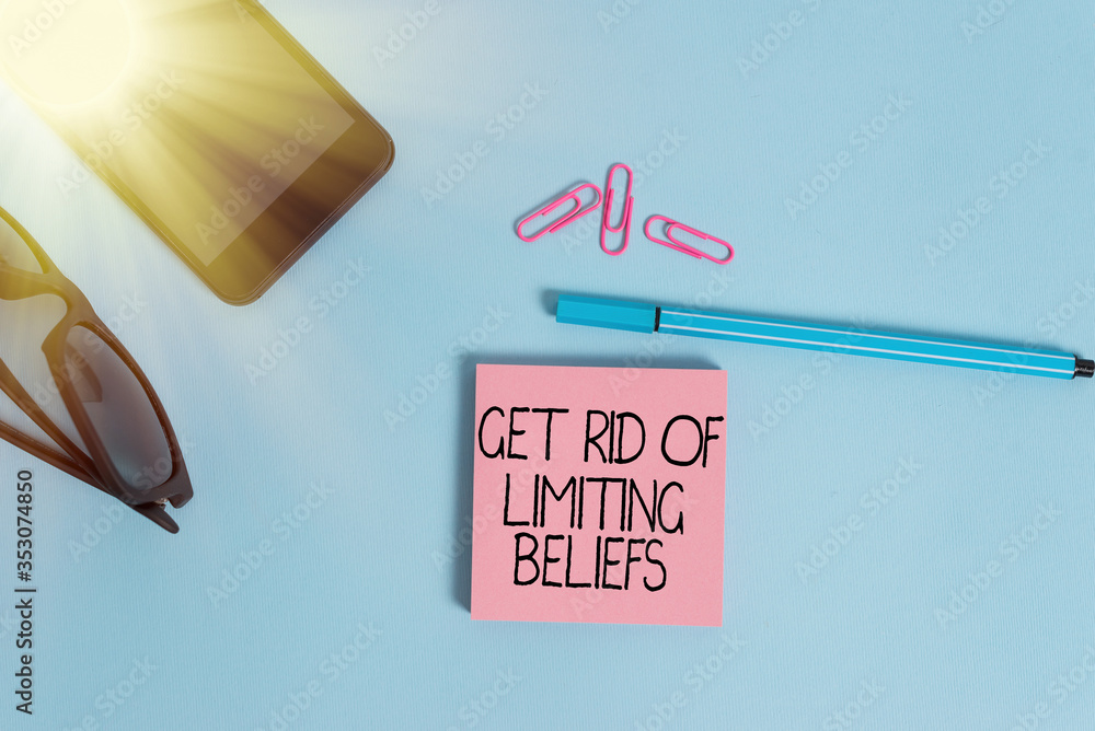 Aufkleber writing note showing get rid of limiting beliefs. business concept for remove negative beliefs and t