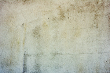 Texture of a concrete wall with cracks and scratches which can be used as a background