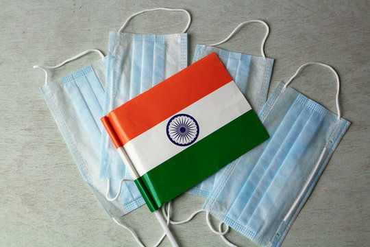 Medical masks and indian flag on the table. The concept is an epidemic in India.