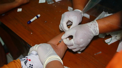 Unfocused, Blurry selective focus and noise image COVID-19 virus disease test, Coronavirus crisis, global pandemic outbreak, rapid strep test (RST) kit, quick antigen detection testing (RADT)