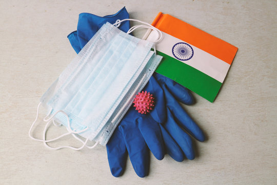 Medical masks, latex gloves and indian flag on the table. The concept is an epidemic in India.