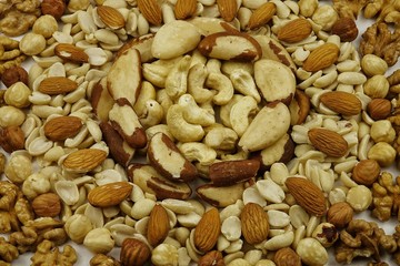 Frame of peeled nuts of different types, background