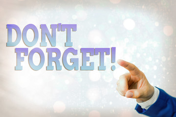 Writing note showing Don T Forget. Business concept for used to remind someone about an important...