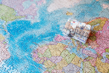 Tourist attractions and souvenir of gondola, venice, italy on background map of world of puzzles for travelers. Copy space