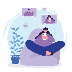 young woman sitting on chair using smartphone chatting