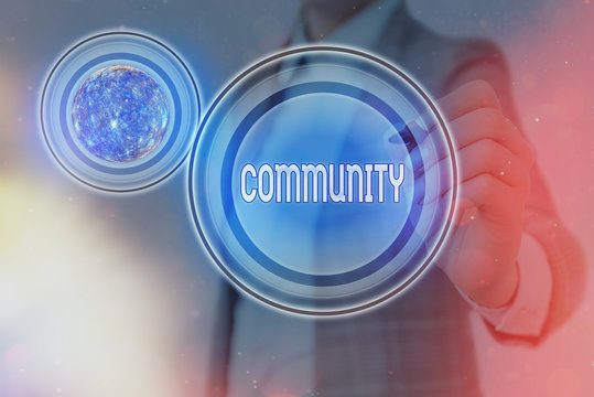 Text sign showing Community. Business photo showcasing specific population with a common characteristics living together Elements of this image furnished by NASA