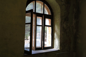 View of open broken window of building
