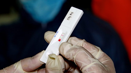 Unfocused, Blurry selective focus and noise image COVID-19 virus disease test, Coronavirus crisis, global pandemic outbreak, rapid strep test (RST) kit, quick antigen detection testing (RADT)