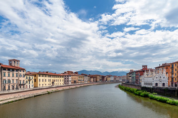 Fototapeta na wymiar Beautiful view of the Lungarni of Pisa, Italy, of the historic center with the Church of Santa Maria della Spina from the Solferino bridge