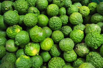 Top view of fresh green tropical bergamot with rough surface peel skin and texture sold in local market 