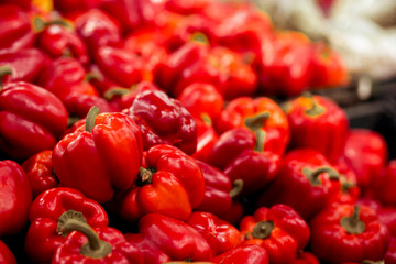 Footage of fresh ripe red sweet bell pepper in box on sale at grocery food store.